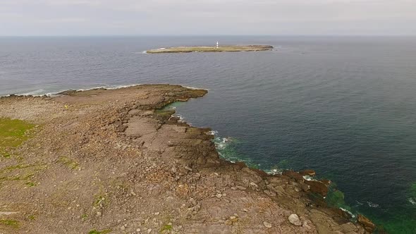 Aerial flight over dramatic aran islands terrain in Ireland, Europe alt