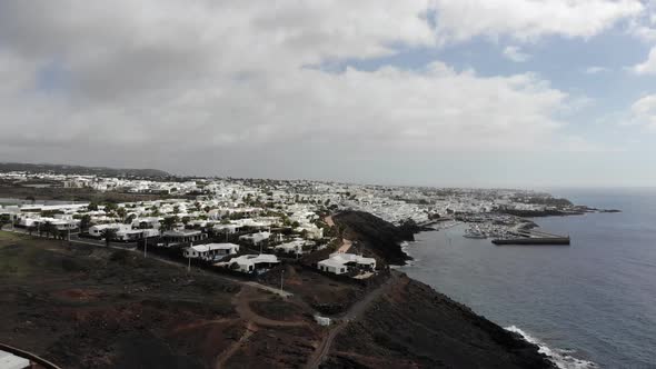 Aerial drone footage of the beautiful Lanzarote hotels and homes alt