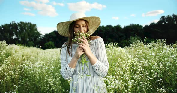 Portrait of Happy Woman With Flowers