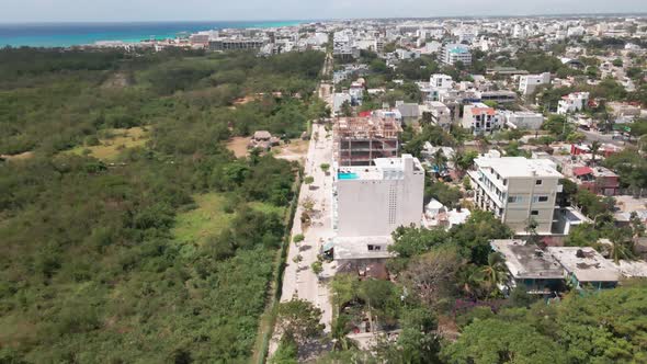 Aerial drone showing Playa Del Carmen, Mexico. Massive jungle, trees, ocean. alt