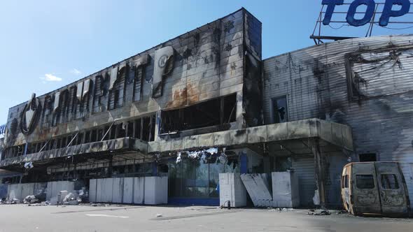 War in Ukraine  Destroyed Building of a Shopping Center in Bucha alt