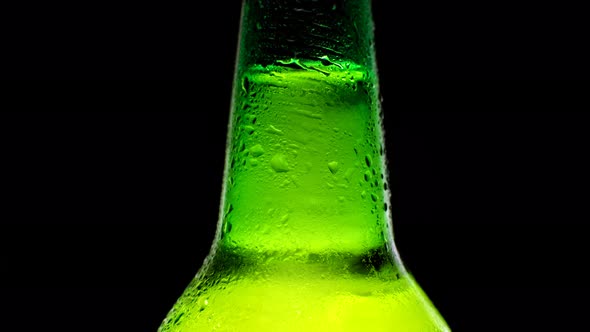 Close Up Cold Neck of a Beer Bottle with Water Drops