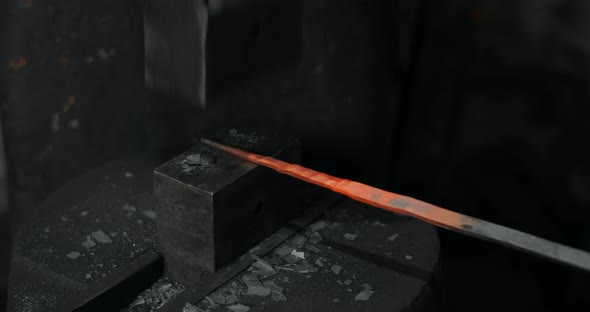 Blacksmith Uses a Hydraulic Hammer to Forge Hot Metal in His Workshop Automatic Hammer is Shaping alt