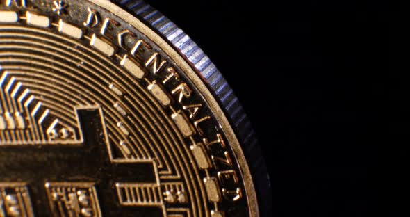 Macro shot of a valuable peer to peer digital cryptocurrency bitcoin with the word decentralized and alt