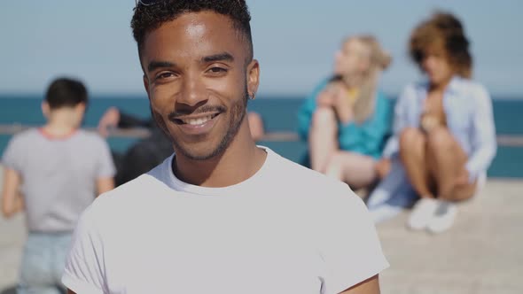 Smiling Young Ethnic Man in Sunshine alt