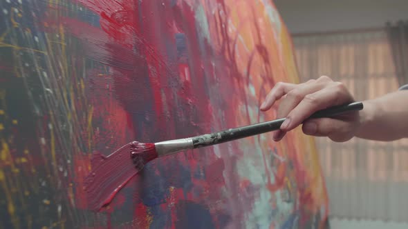 Hand Holding Paint Brush And Painting alt