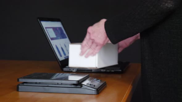 Weighing, packing and shipping an item sold online in a cardboard box with bubble wrap to a customer alt