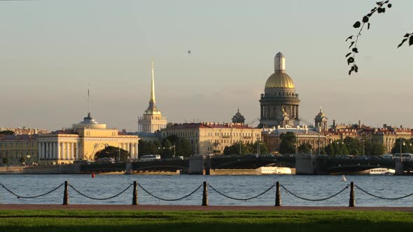 Embankment of the Neva river and the Admiralty, Isaac's Cathedral and Palace Bridge in the evening