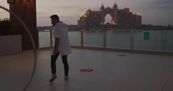 Wheel Gymnastics in the Evening with Gorgeous Atlantis Hotel in the Background alt