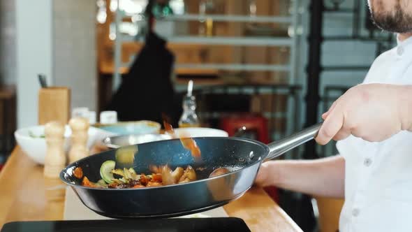 Flying Vegetables Fried on Pan Chef Throwing Food in Slow Motion Tossing