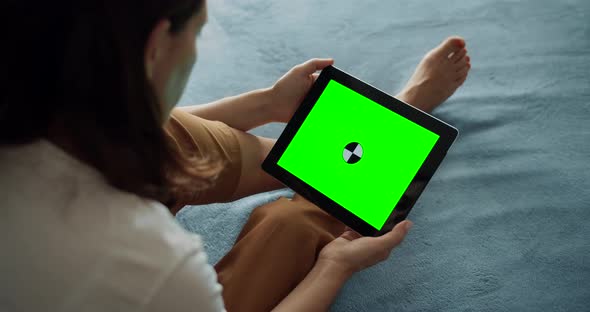 Woman Holding Greenscreen Tablet