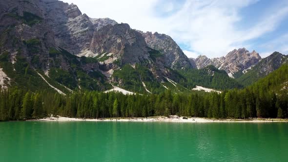 Lake Braies aka Pragser Wildsee in South Tyrol Italy, Aerial tilt up reveal shot alt
