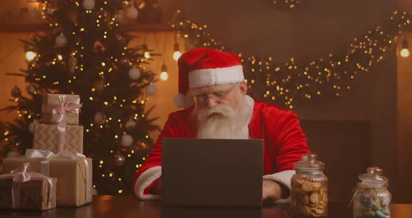 Real Santa Claus Using New Technology for Communication with Children, Receiving Mail or Wish List alt