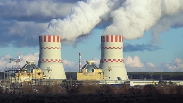Cooling towers of Nuclear power plant emissions of steam in the air atmosphere alt