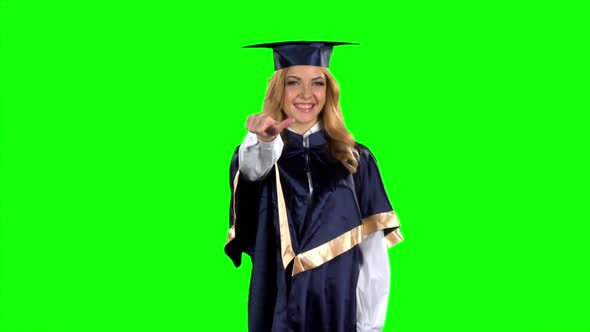 Graduate Girl with a Thumbs Down. Green Screen. Slow Motion alt