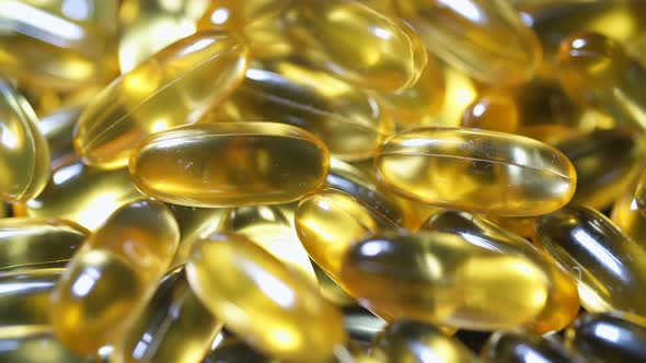 Omega 3 Fish Oil Capsules Close up Macro Supplement Vitamin Defocus Transition alt