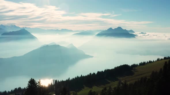 aerial view over amazing mountain landscape with fog covered mountains and lake. rigi switzerland alt