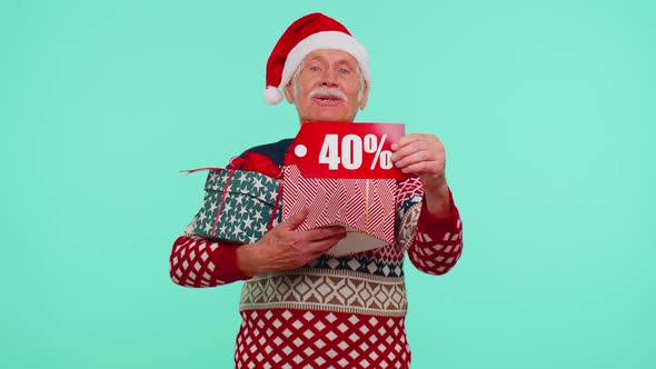 Grandfather in Christmas Sweater Showing Gift Box and 40 Percent Discount Inscriptions Banner Text alt