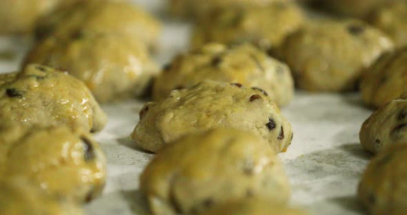 Dough Brushed With Beaten Egg In A Baking Tray - slow sliding shot alt