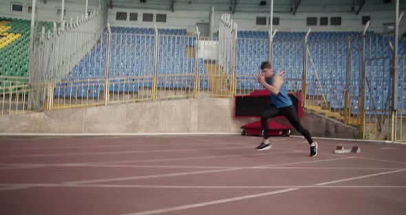 Young Athlete Leaping Over Barriers alt