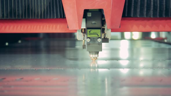Close Up of Metal Getting Cut By a Laser Machine alt