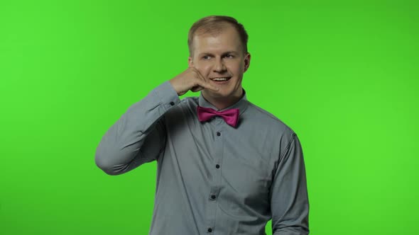 Hello, Call Me. Man Standing with Telephone Hand Gesture Near Head and Communicate, Talk By Phone alt