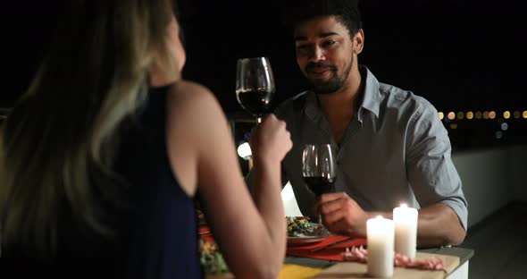 Beautiful Couple in Love Having Romantic Dinner at Night