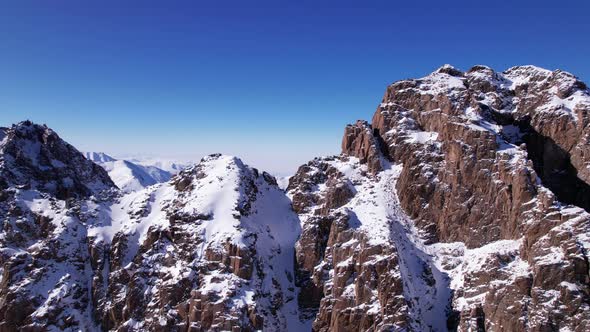 Drone View of the High Snowy Peaks of Kazakhstan alt