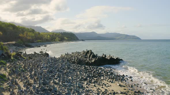 A Road By The Ocean Side With Balancing Stones At Wangetti, Cairns In Queensland, Australia