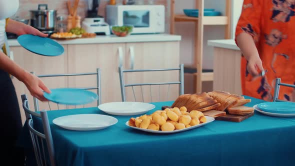 Close Up of Family Dinner Table Set alt