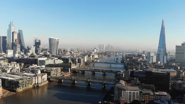 Aerial view of the Shard and London's tallest skyscrapers from financial District on a sunny day alt