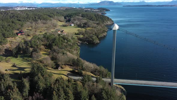 Tower of Bomlo suspension bridge before revealing full bridge view and Spissousundet fjord alt