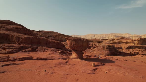 An interesting mushroom-like rock formation in the desert, filmed in Nature Park Timna, southern Isr alt