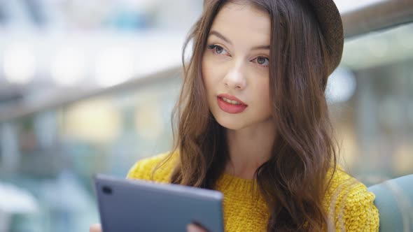 Young Woman Using Tablet for Reading alt