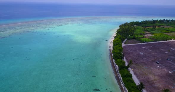 Luxury drone copy space shot of a sandy white paradise beach and aqua turquoise water background  alt