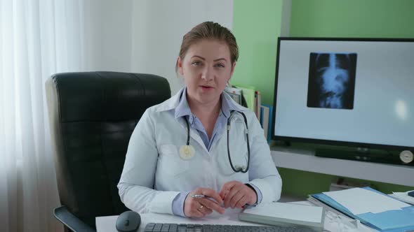 Remote Medicine, Female Doctor Conducts an Online Consultation with Help of Modern Technologies and alt