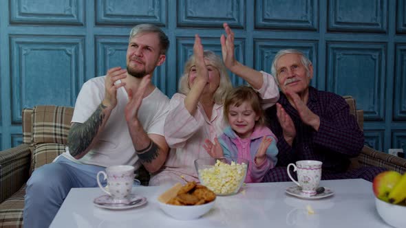 Multigenerational Happy Family Laughing Watching Comedy Cartoons Television Movies Eating Popcorn alt
