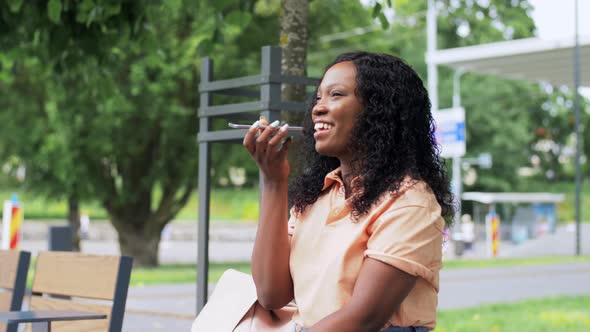 African Woman Recording Voice on Smartphone alt