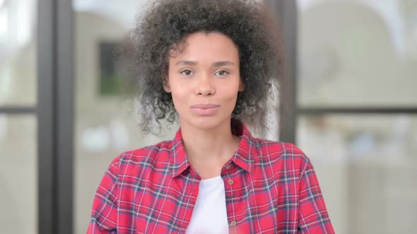 Portrait of African Woman Giving Flying Kiss alt