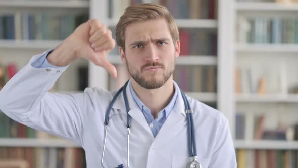 Portrait of Doctor Showing Thumbs Down Sign alt