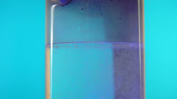 Glass Kettle Rotation on Blue Background