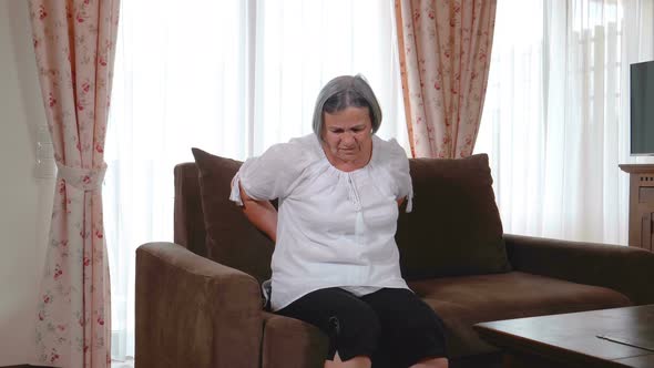 Senior Woman Suffering from Backache 