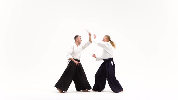 Two Fellows Showing Aikido Using Tanto. Isolated, White. Close Up alt