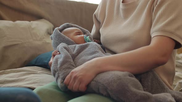 mother-rocking-baby-to-sleep-stock-footage-videohive