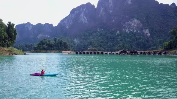 Cute Asian Girl Kayaking Floating Houses Cheow Lan Lake Thailand alt