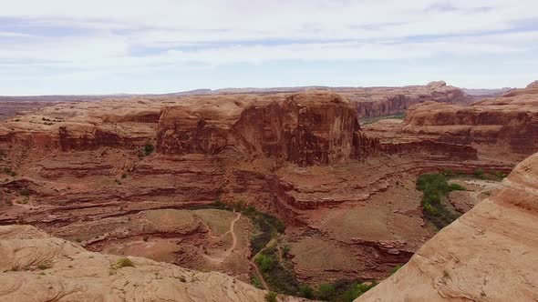 Reverse footage over summit in Moab alt
