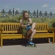 Female Roller Putting on Roller Blades on Bench - VideoHive Item for Sale