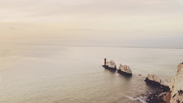 Aerial Drone Shot of Isle of Wight The Needles Orange Sunset, Chalk Cliffs Stacks Rock Formations on alt