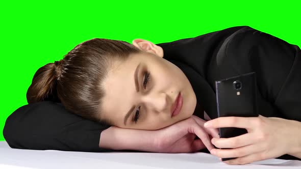 Tired Working Answering the Phone in Her Office. Green Screen alt