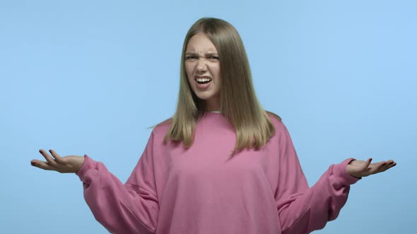 Slow Motion of Young Caucasian Woman Spread Hands Sideways Clueless Saying I Dont Know Nothing and alt